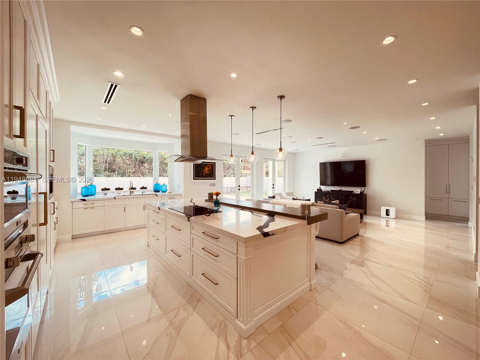7233 Southwest 122 Place Miami, FL 33183 - Photo 11 of 58 a view of living room kitchen with stainless steel appliances furniture stove microwave and cabinets