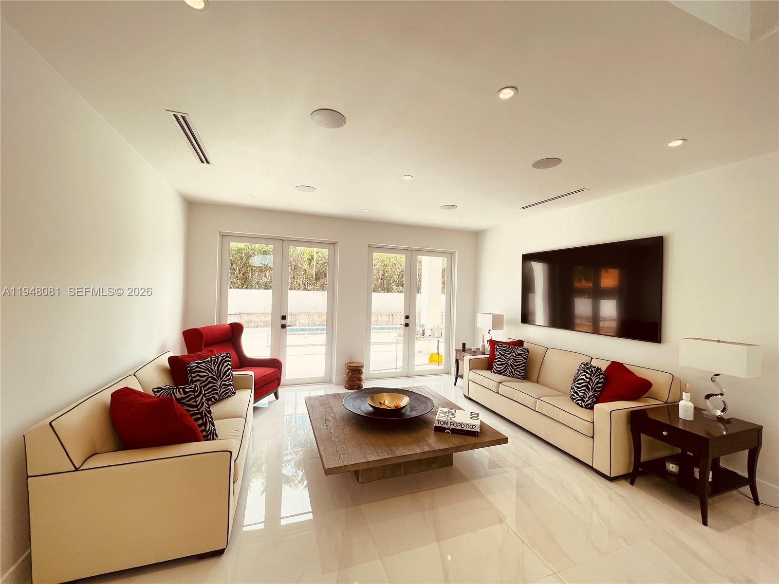 7233 Southwest 122 Place Miami, FL 33183 - Photo 14 of 78 a living room with furniture and a flat screen tv