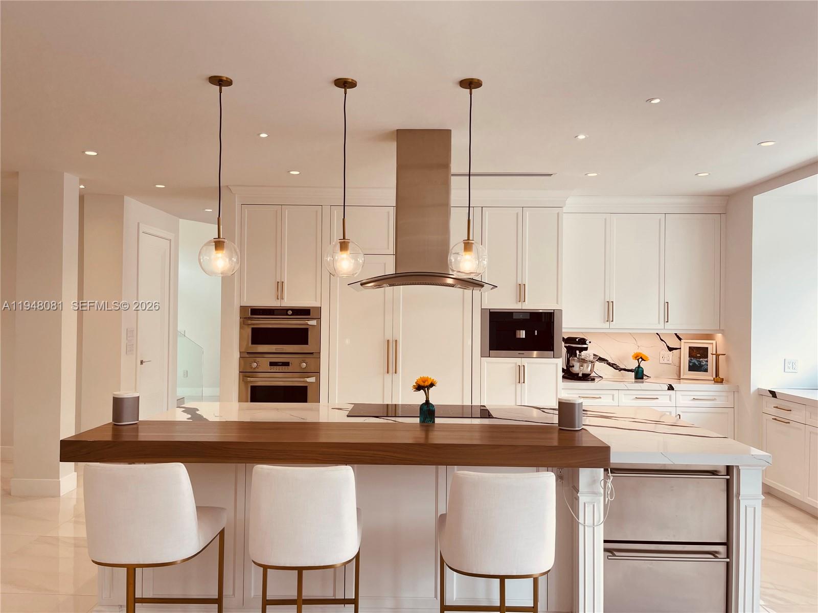 7233 Southwest 122 Place Miami, FL 33183 - Photo 16 of 58 a kitchen with stainless steel appliances kitchen island granite countertop a sink and cabinets