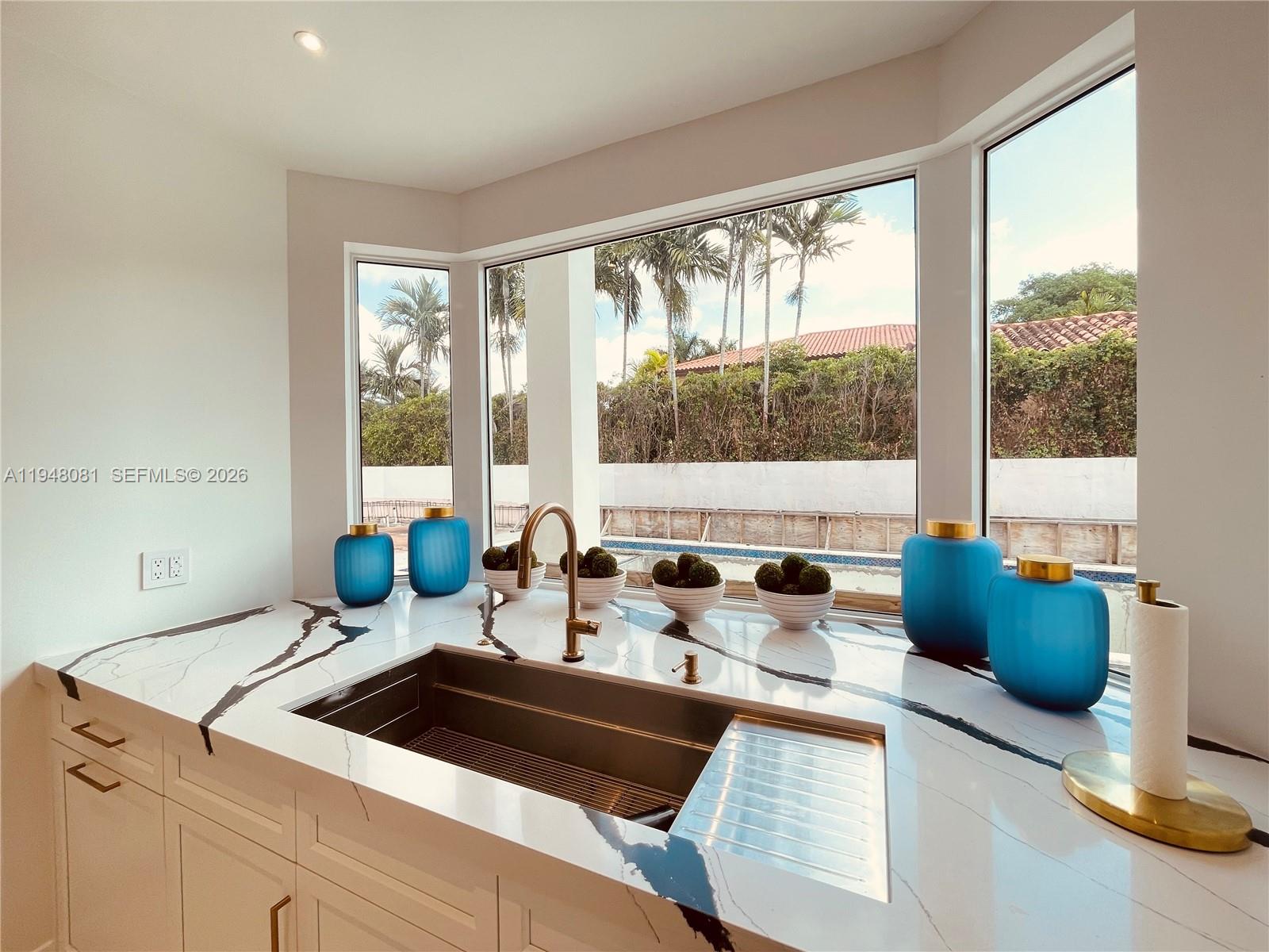 7233 Southwest 122 Place Miami, FL 33183 - Photo 19 of 58 a kitchen with a large window and a sink