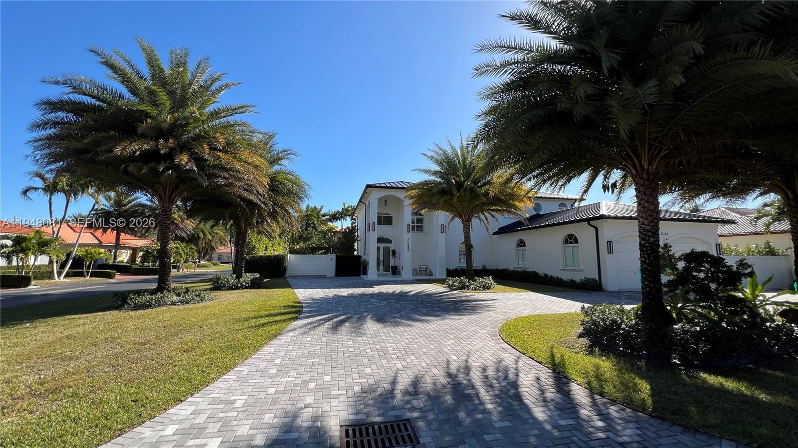 7233 Southwest 122 Place Miami, FL 33183 - Photo 2 of 78 a view of a backyard with a garden and palm trees