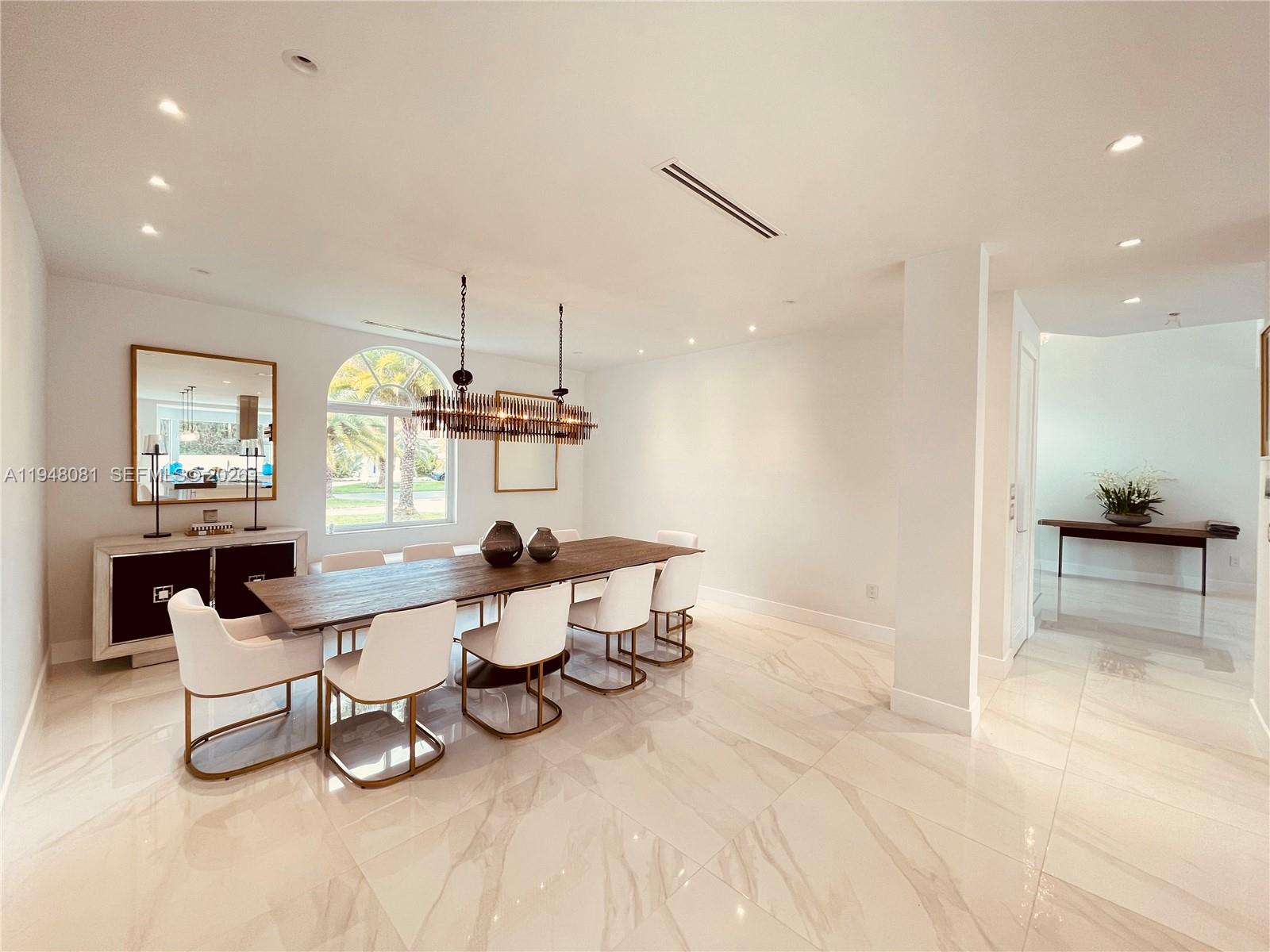 7233 Southwest 122 Place Miami, FL 33183 - Photo 26 of 78 a living room with couches and kitchen view with wooden floor