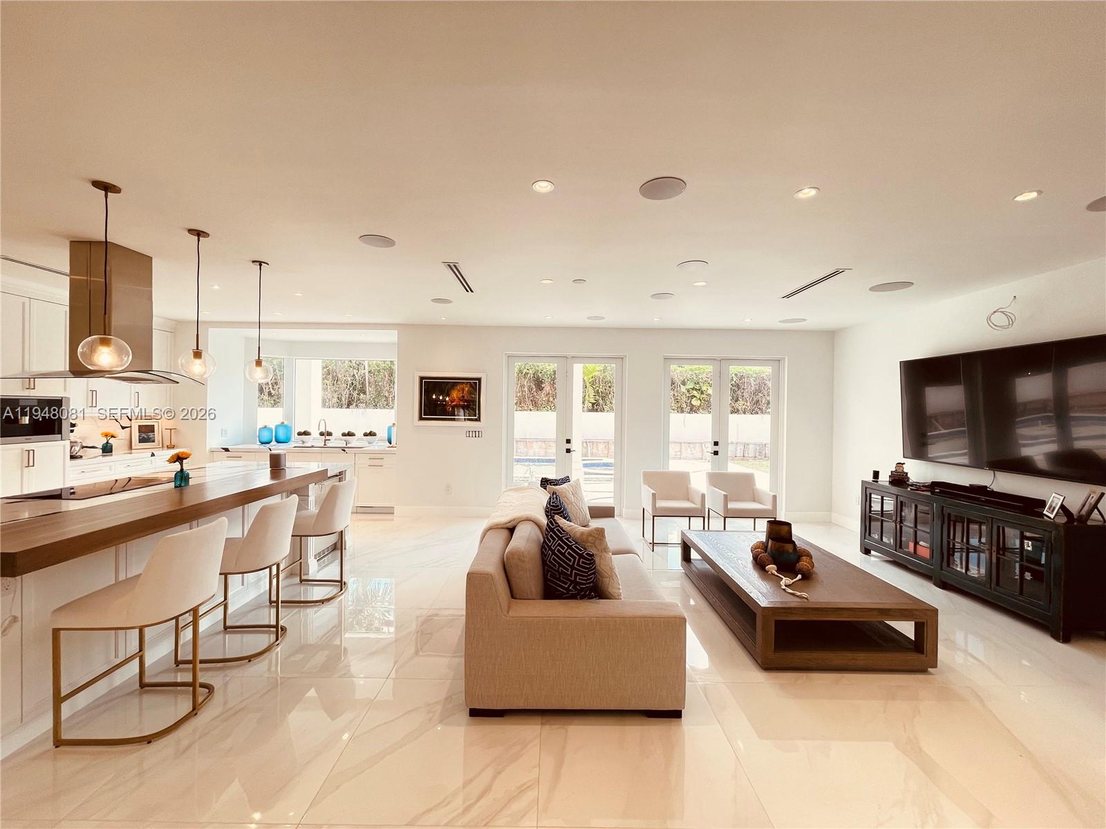 7233 Southwest 122 Place Miami, FL 33183 - Photo 28 of 78 a living room with furniture and a flat screen tv