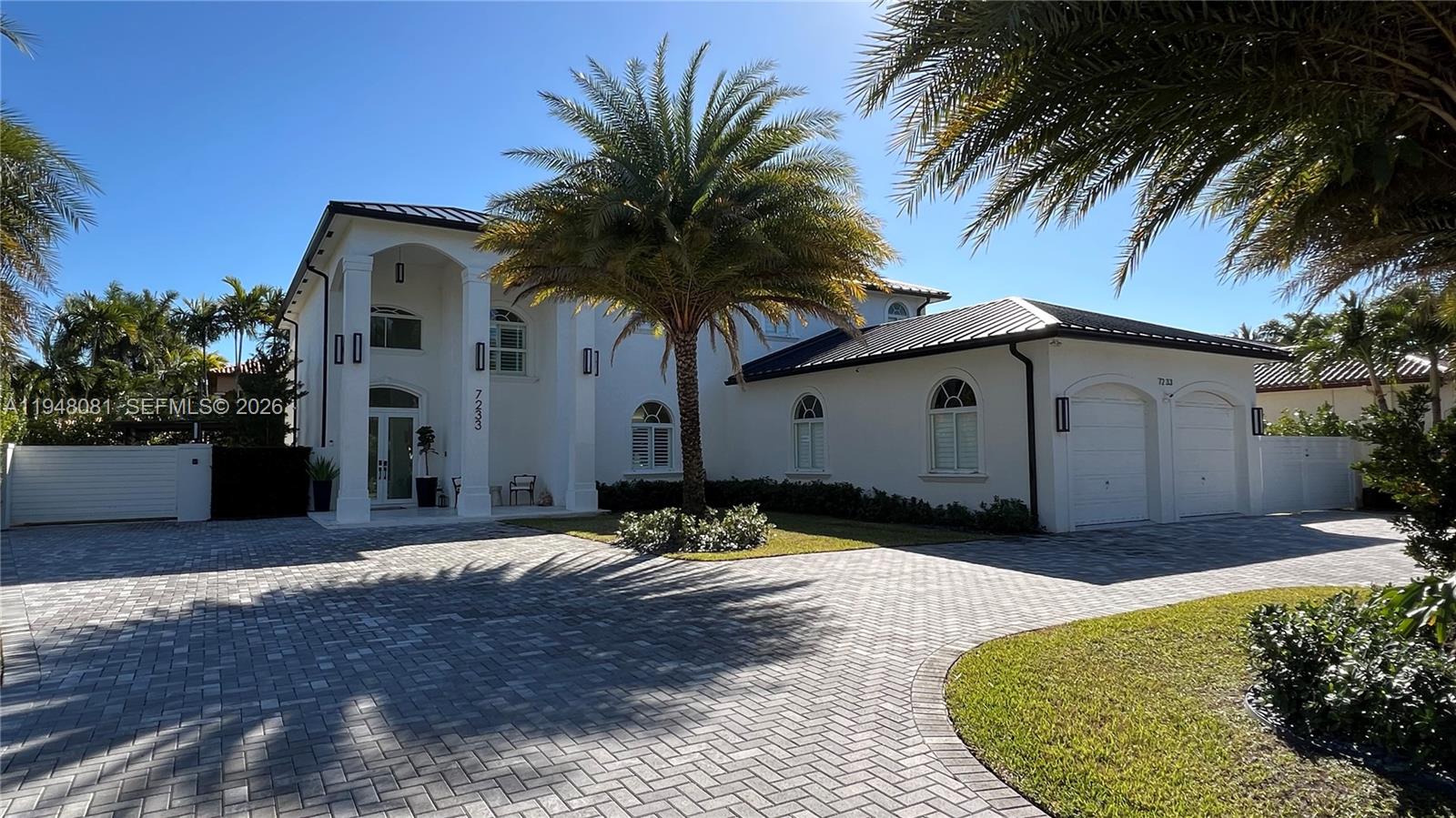 7233 Southwest 122 Place Miami, FL 33183 - Photo 3 of 78 a front view of house with yard and trees