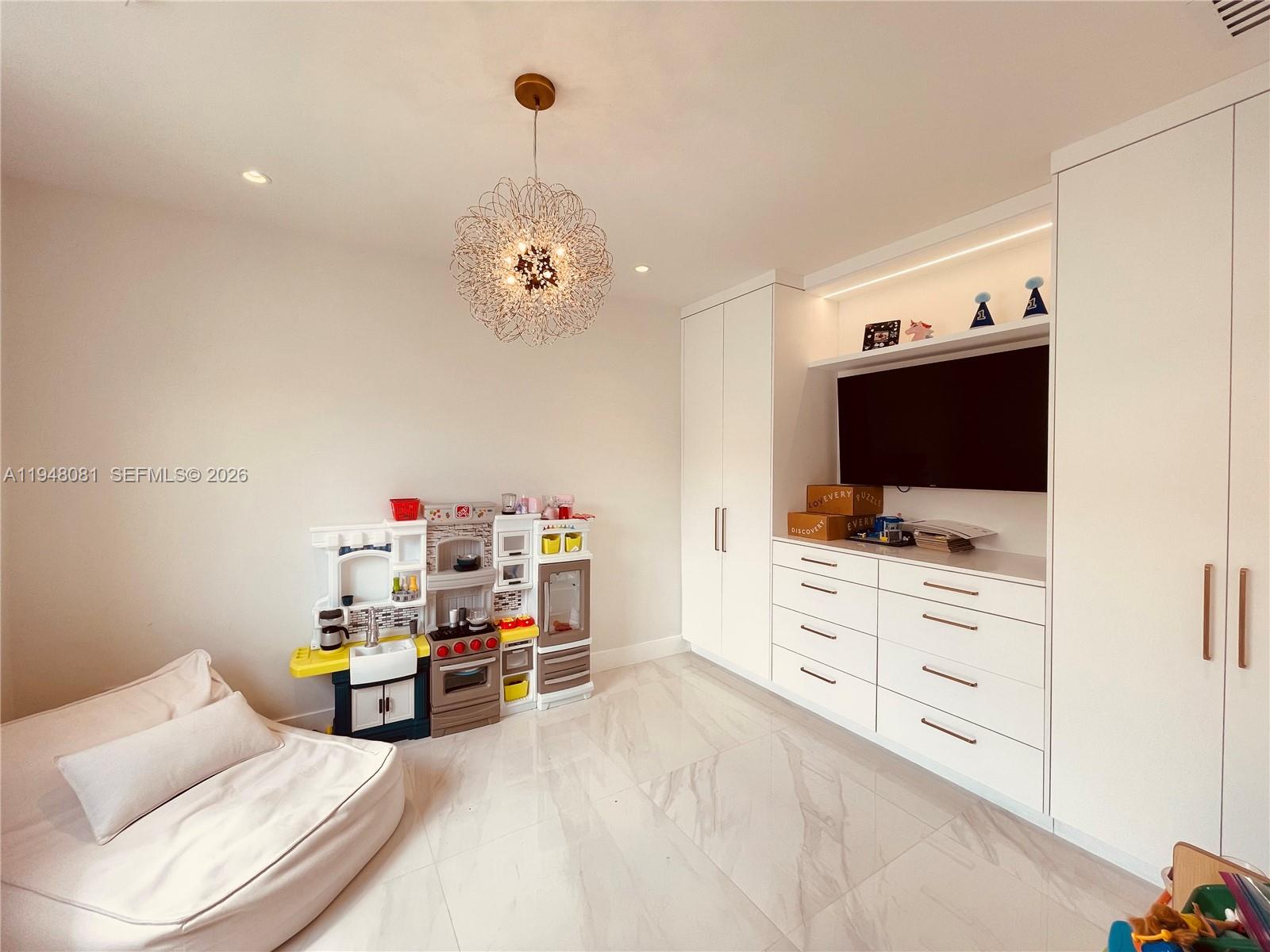 7233 Southwest 122 Place Miami, FL 33183 - Photo 33 of 78 a living room with furniture and a flat screen tv