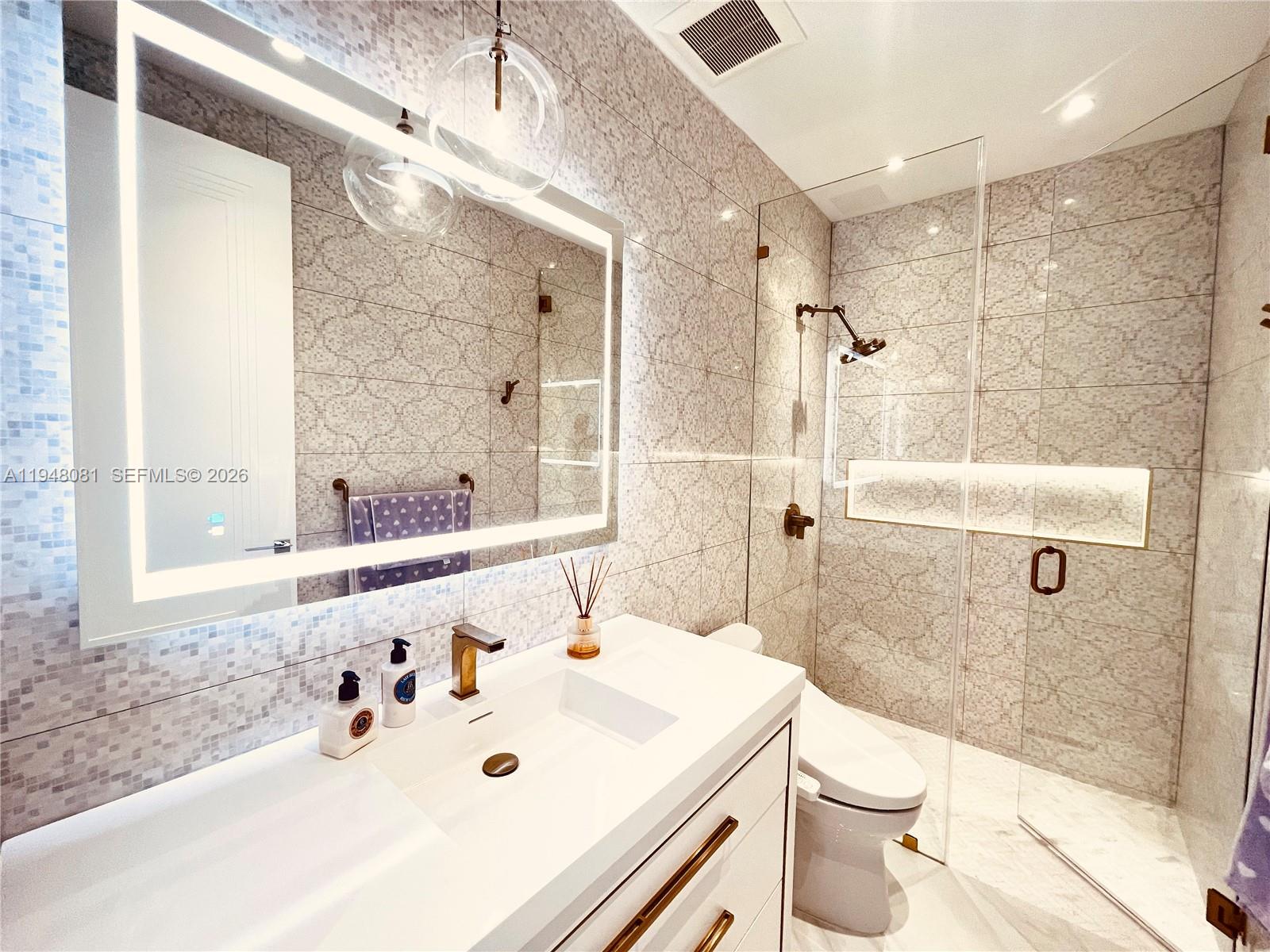 7233 Southwest 122 Place Miami, FL 33183 - Photo 37 of 58 a bathroom with a sink a toilet and shower