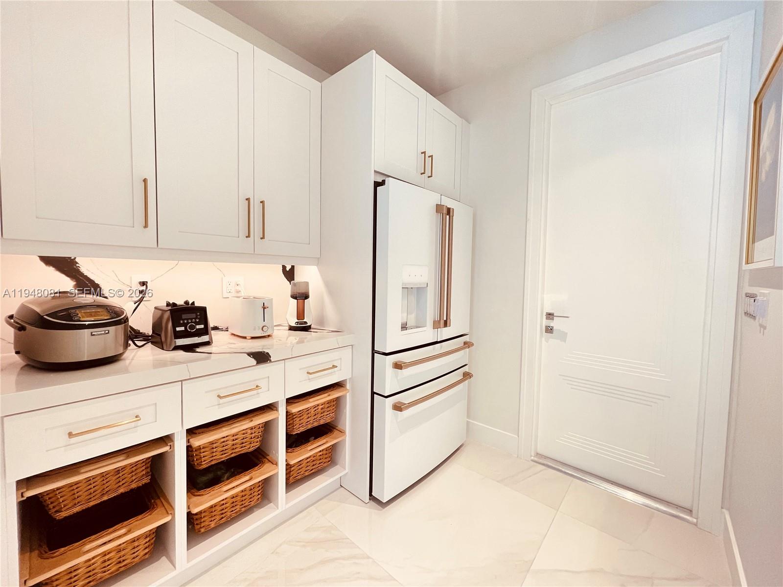 7233 Southwest 122 Place Miami, FL 33183 - Photo 38 of 78 a kitchen with stainless steel appliances a refrigerator sink and cabinets