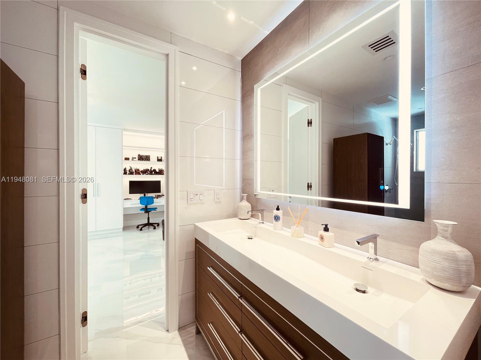 7233 Southwest 122 Place Miami, FL 33183 - Photo 41 of 78 a bathroom with a sink and a mirror