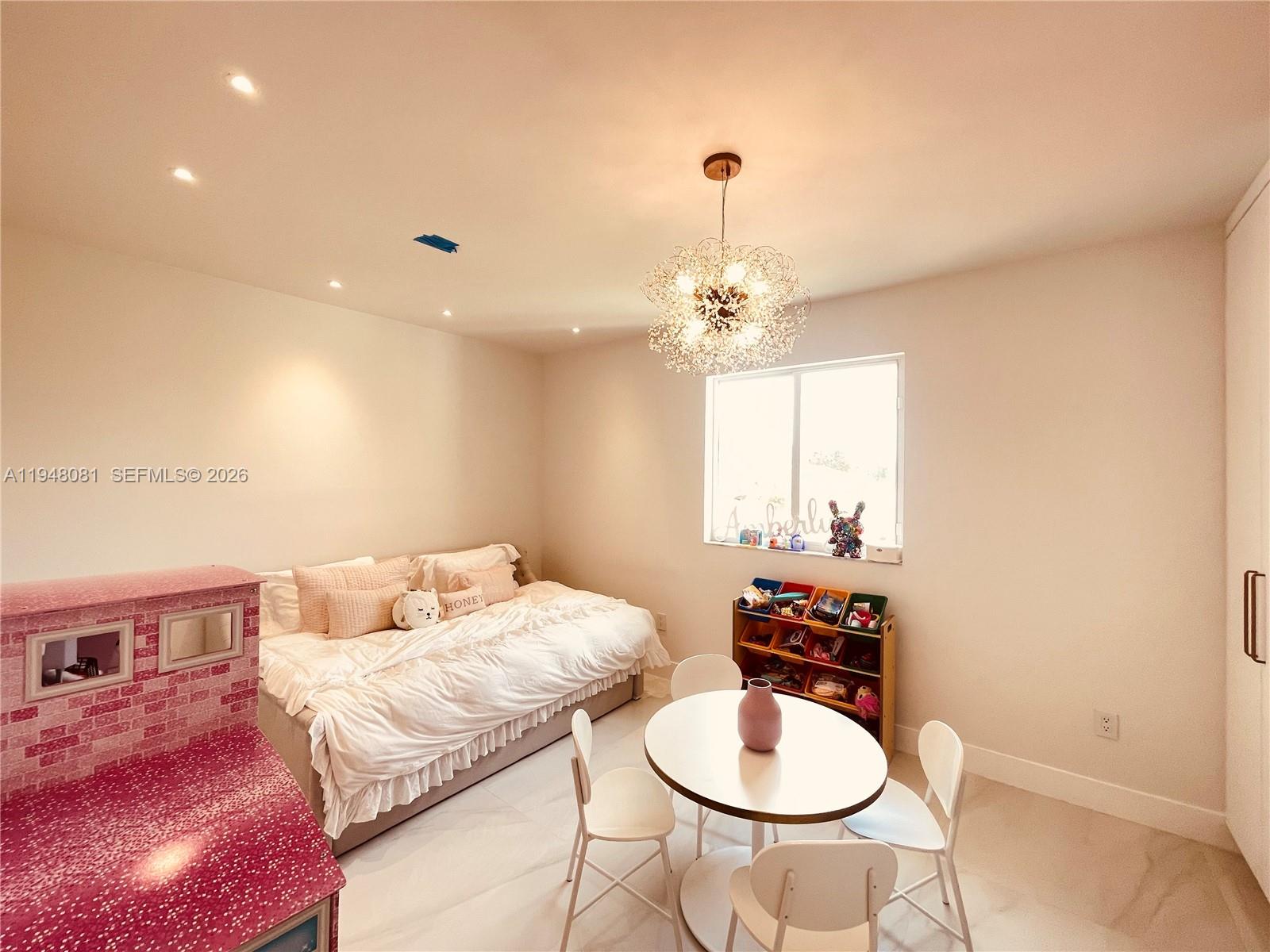 7233 Southwest 122 Place Miami, FL 33183 - Photo 43 of 78 a bedroom with a bed and a chair