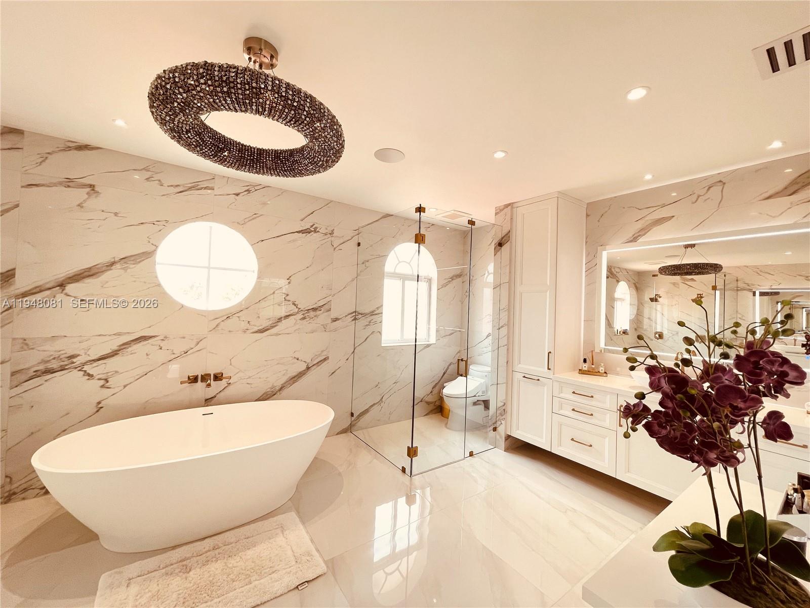 7233 Southwest 122 Place Miami, FL 33183 - Photo 43 of 58 a bathroom with a granite countertop sink and a mirror