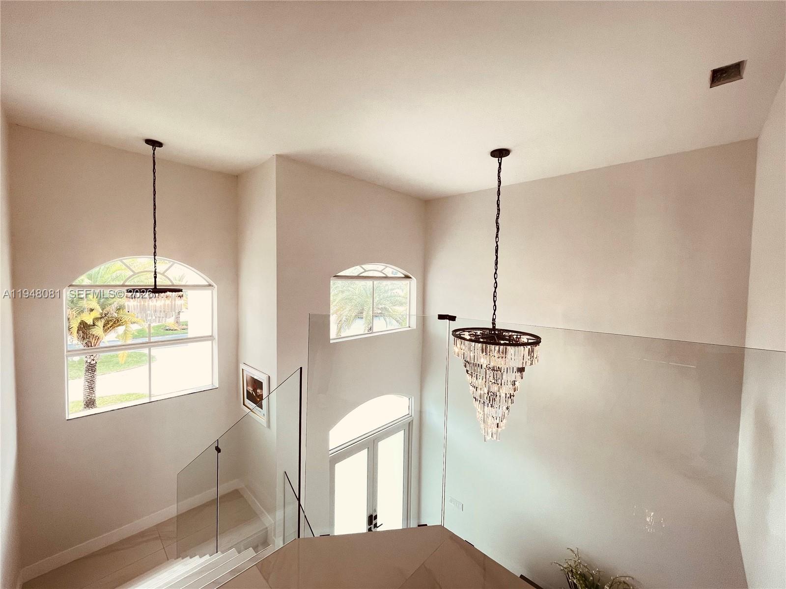 7233 Southwest 122 Place Miami, FL 33183 - Photo 49 of 58 a view of a room with a window and chandelier