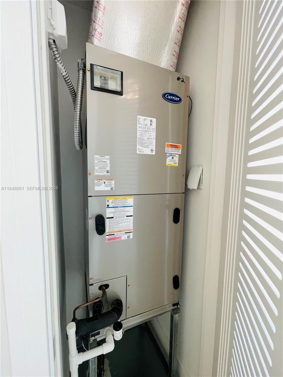 7233 Southwest 122 Place Miami, FL 33183 - Photo 53 of 58 a bathroom with a refrigerator and a sink