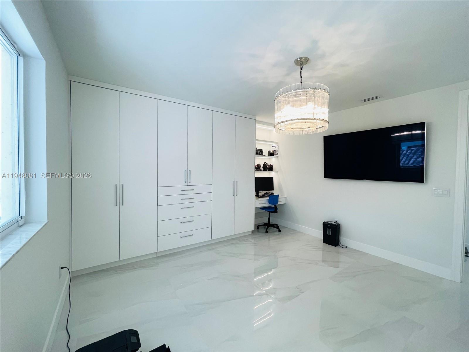 7233 Southwest 122 Place Miami, FL 33183 - Photo 61 of 78 a view of a livingroom with an empty space & a window