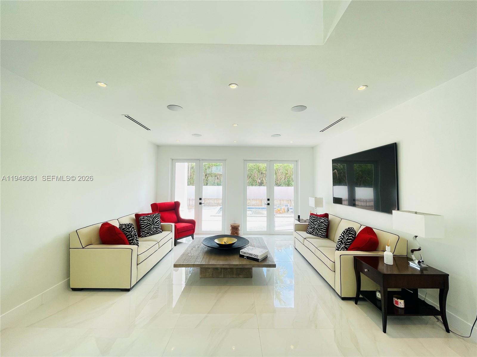 7233 Southwest 122 Place Miami, FL 33183 - Photo 63 of 78 a living room with furniture and a flat screen tv