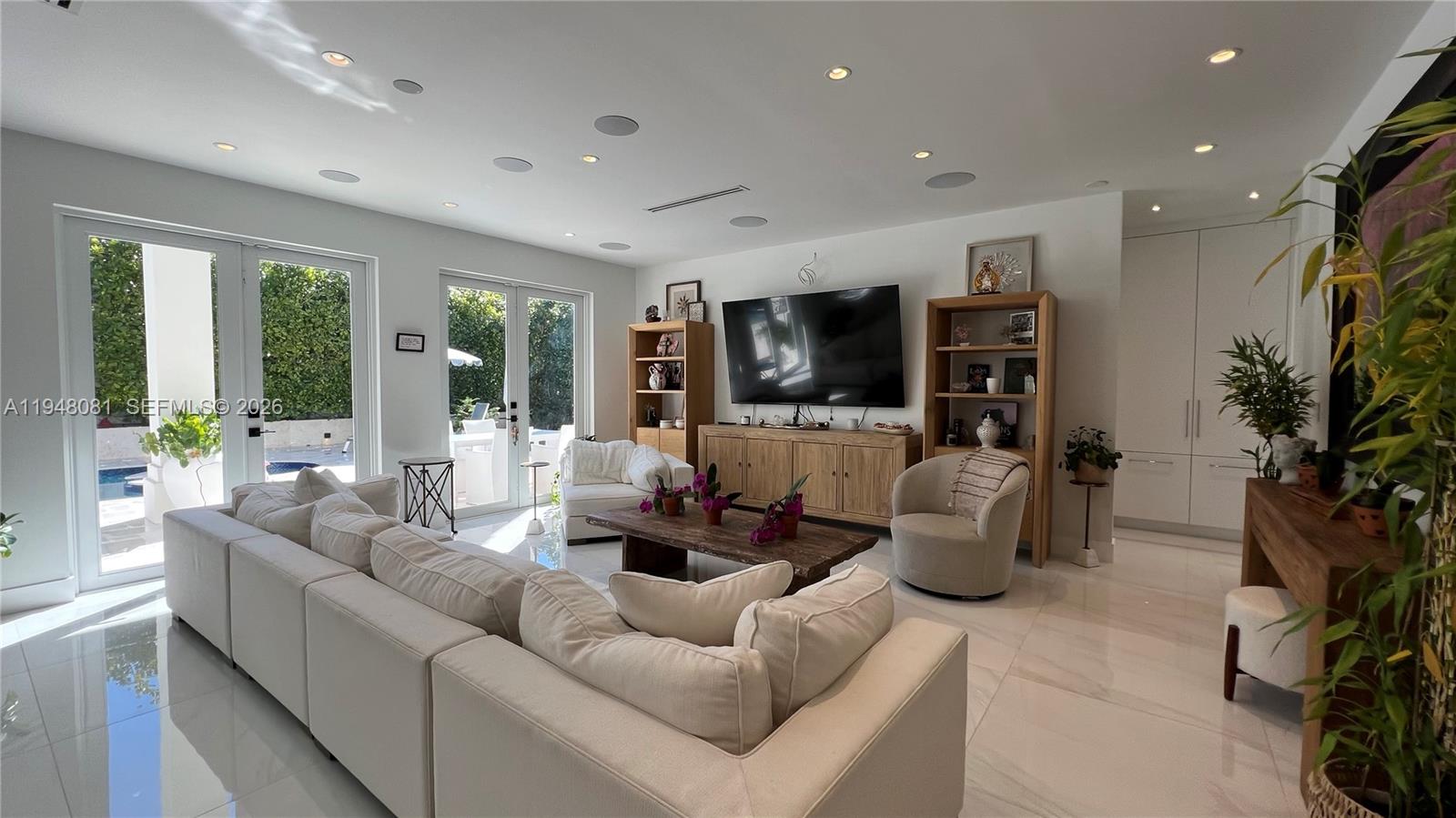 7233 Southwest 122 Place Miami, FL 33183 - Photo 65 of 78 a living room with furniture and a flat screen tv