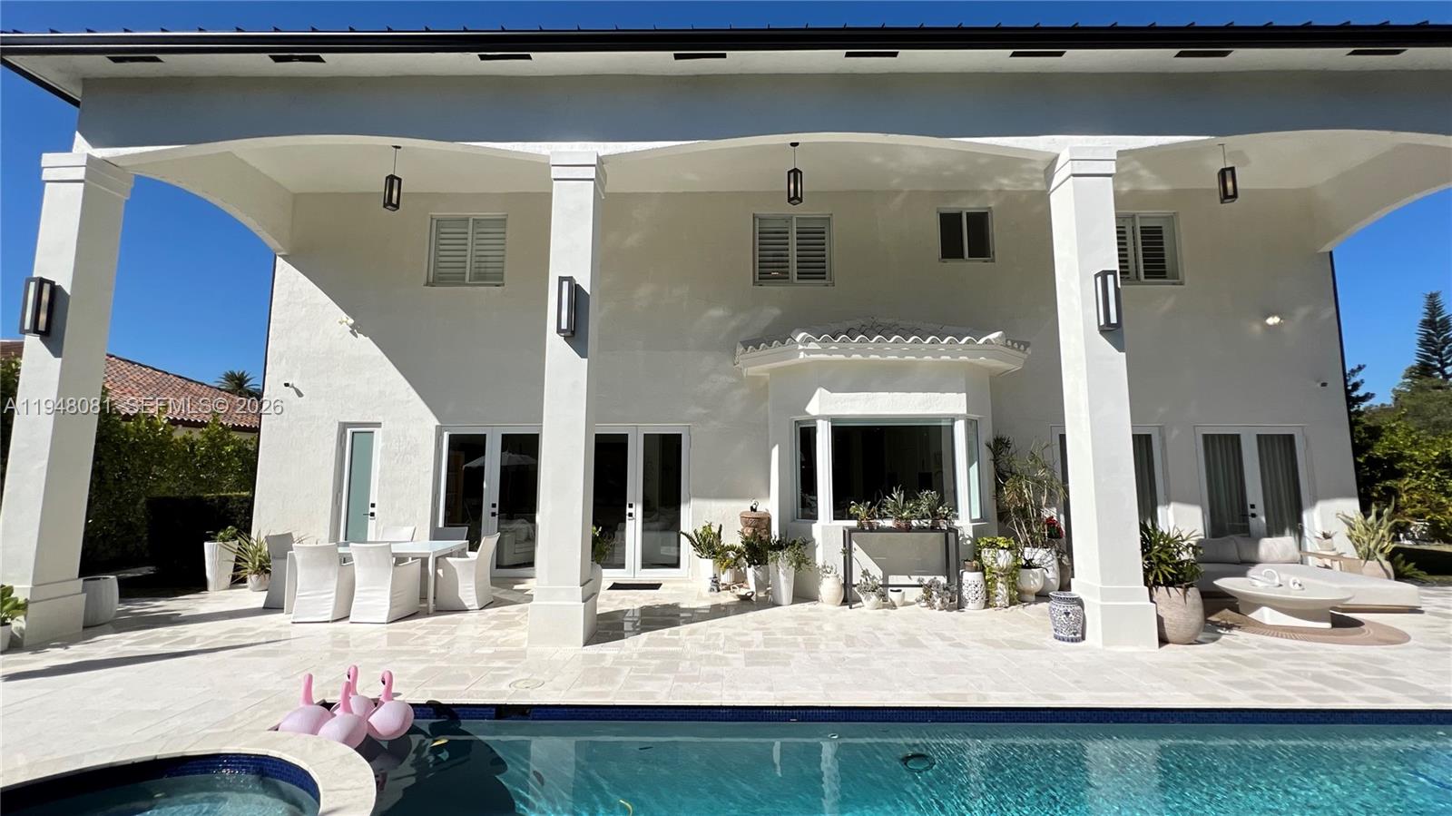7233 Southwest 122 Place Miami, FL 33183 - Photo 67 of 78 a view of living room kitchen with furniture and flat screen tv