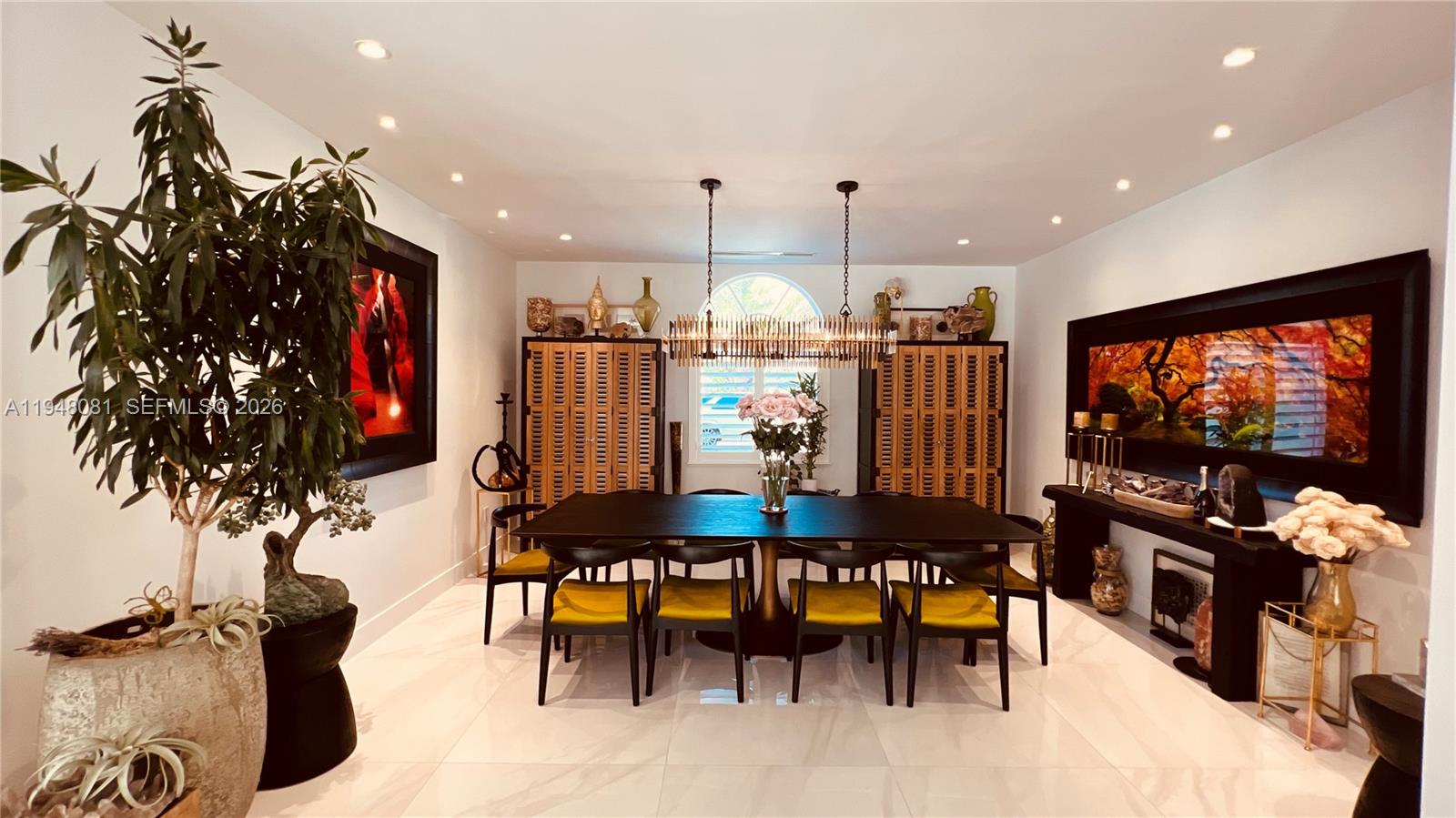 7233 Southwest 122 Place Miami, FL 33183 - Photo 78 of 78 a view of a dining room with furniture one side kitchen view and a chandelier