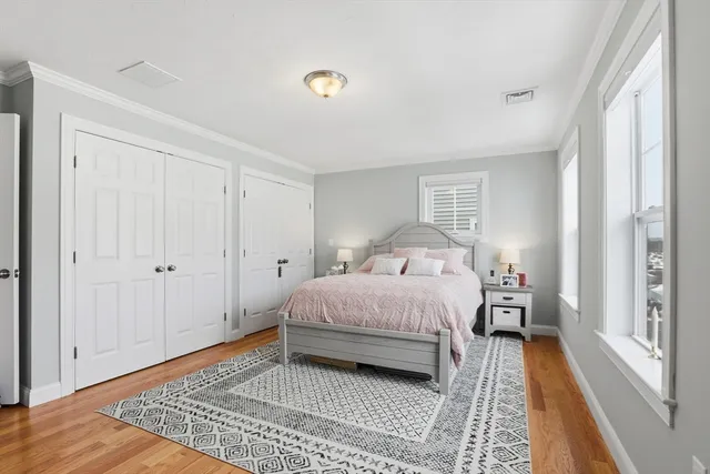 a bathroom with a granite countertop sink mirror vanity and a toilet