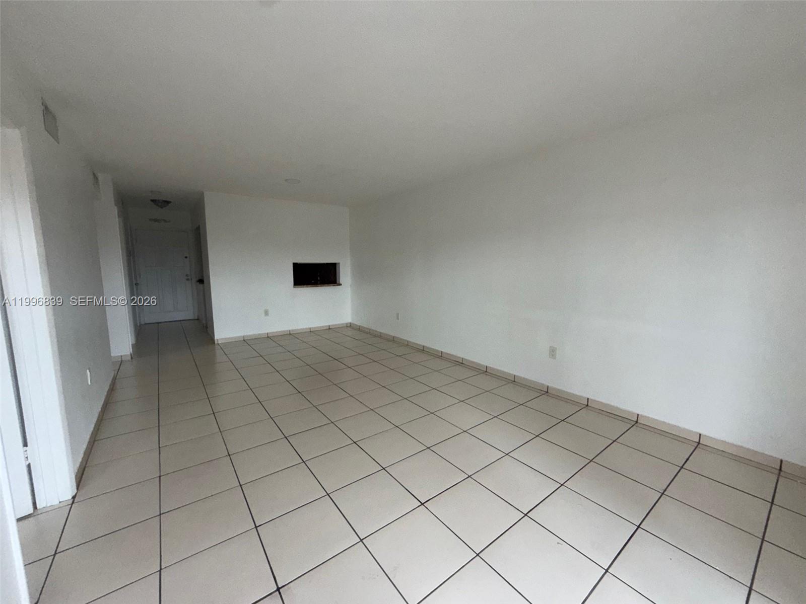 120 Royal Palm Road, Unit 301 Hialeah Gardens, FL 33016 - Photo 12 of 32 a view of a livingroom and an empty space