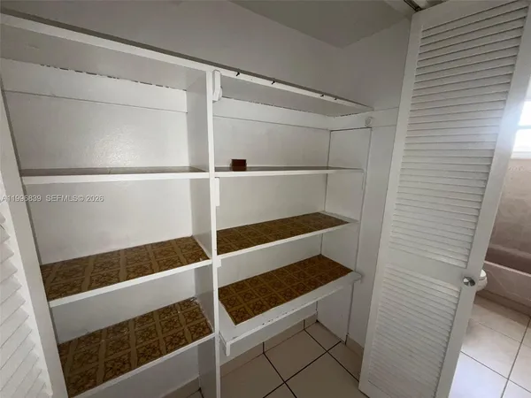 a view of a room with racks on the wall
