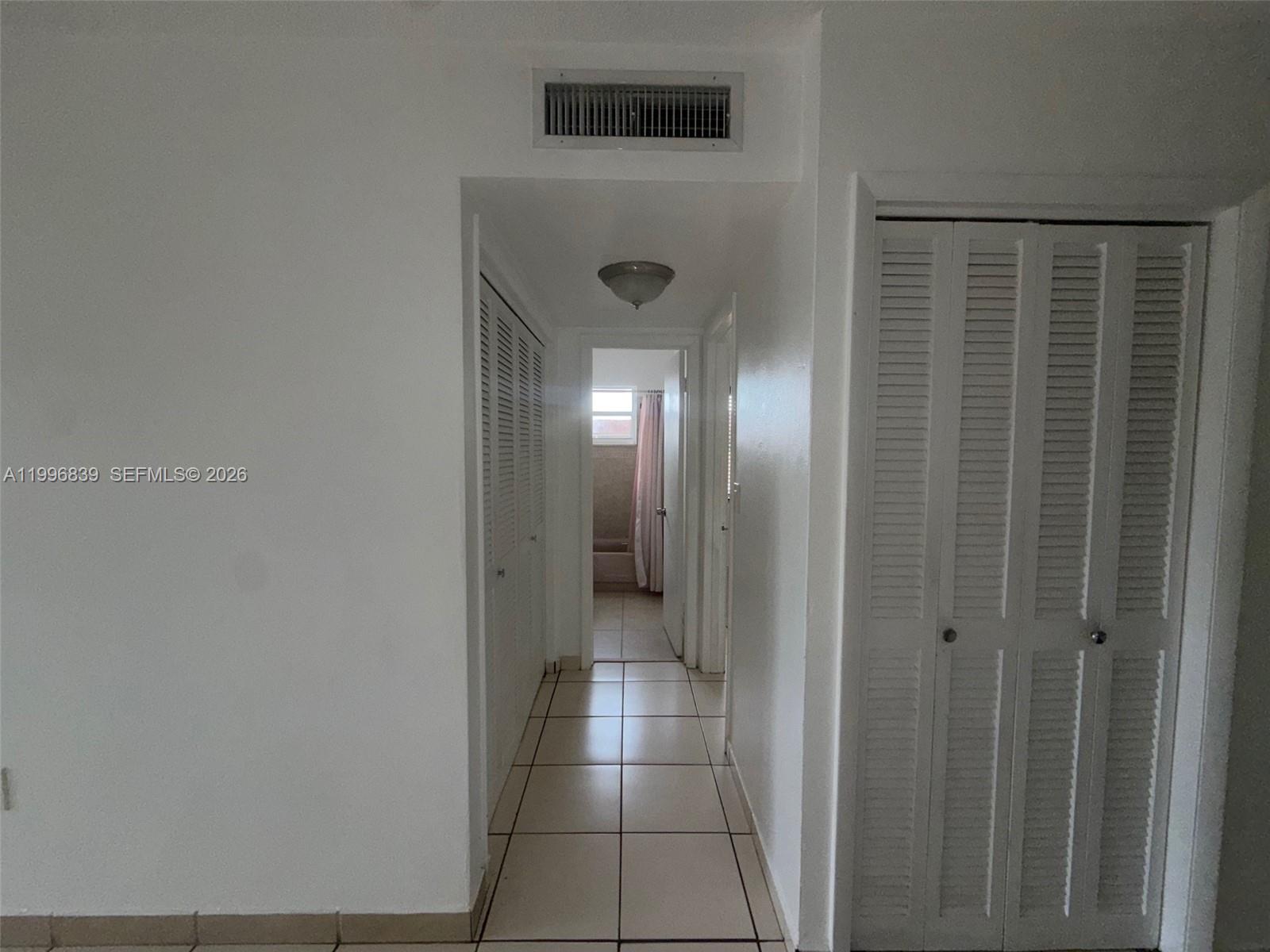 120 Royal Palm Road, Unit 301 Hialeah Gardens, FL 33016 - Photo 14 of 32 a view of a hallway