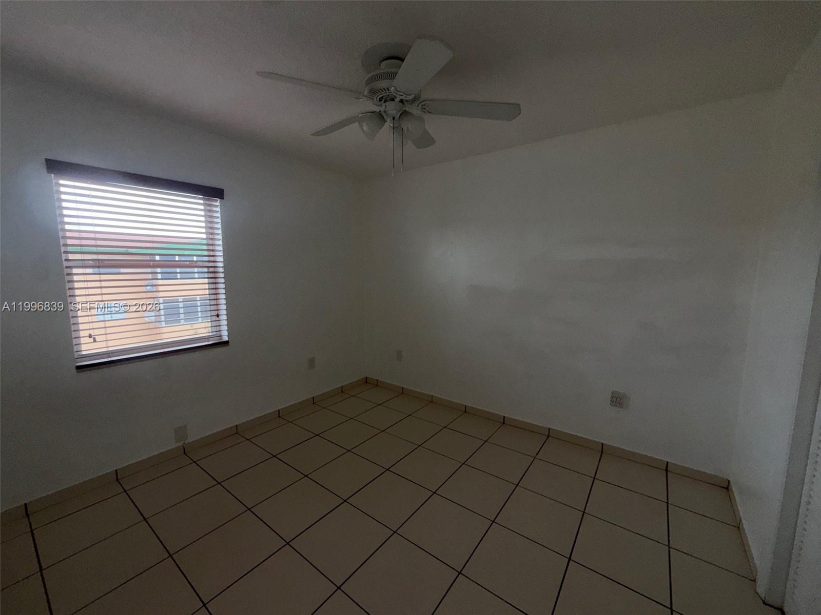 120 Royal Palm Road, Unit 301 Hialeah Gardens, FL 33016 - Photo 15 of 32 an empty room with a window
