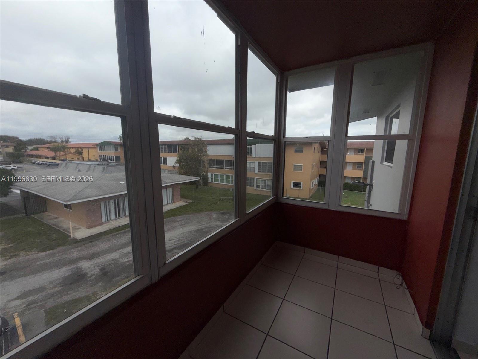 120 Royal Palm Road, Unit 301 Hialeah Gardens, FL 33016 - Photo 26 of 32 a view of railway station from a balcony