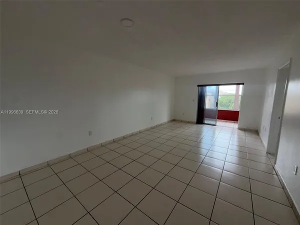 a view of a livingroom and an empty space