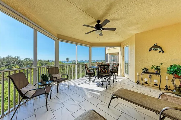 a view of a patio with swimming pool table and chairs