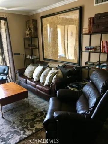 a living room with furniture rug and window