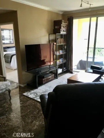 a living room with television and a flat screen tv