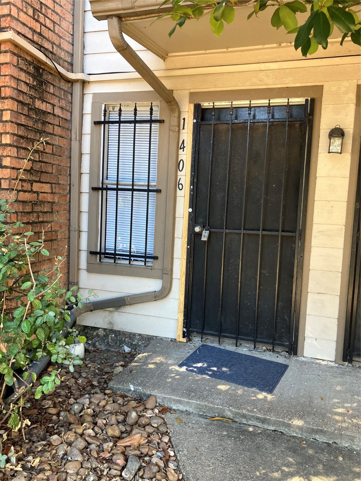 6001 Reims Road, Unit 1406 Houston, TX 77036 - Photo 13 of 13 a view of a house with a wooden fence