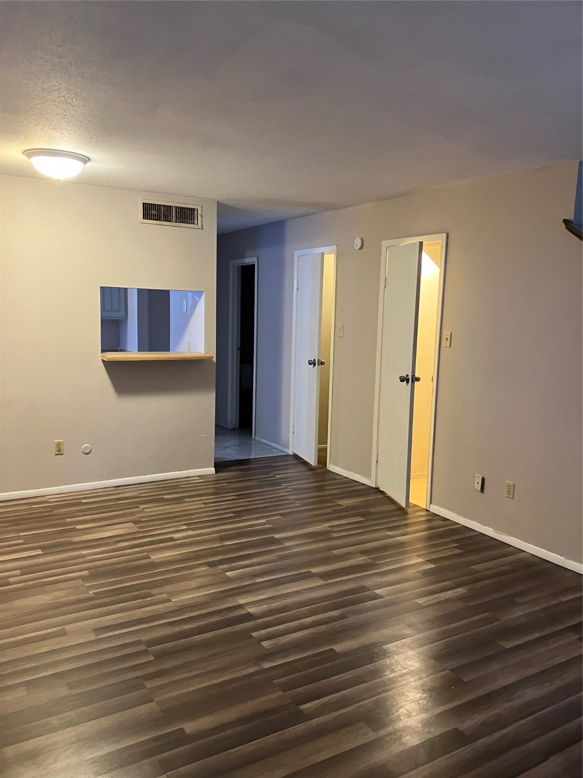 6001 Reims Road, Unit 1406 Houston, TX 77036 - Photo 2 of 13 a view of room with window and wooden floor