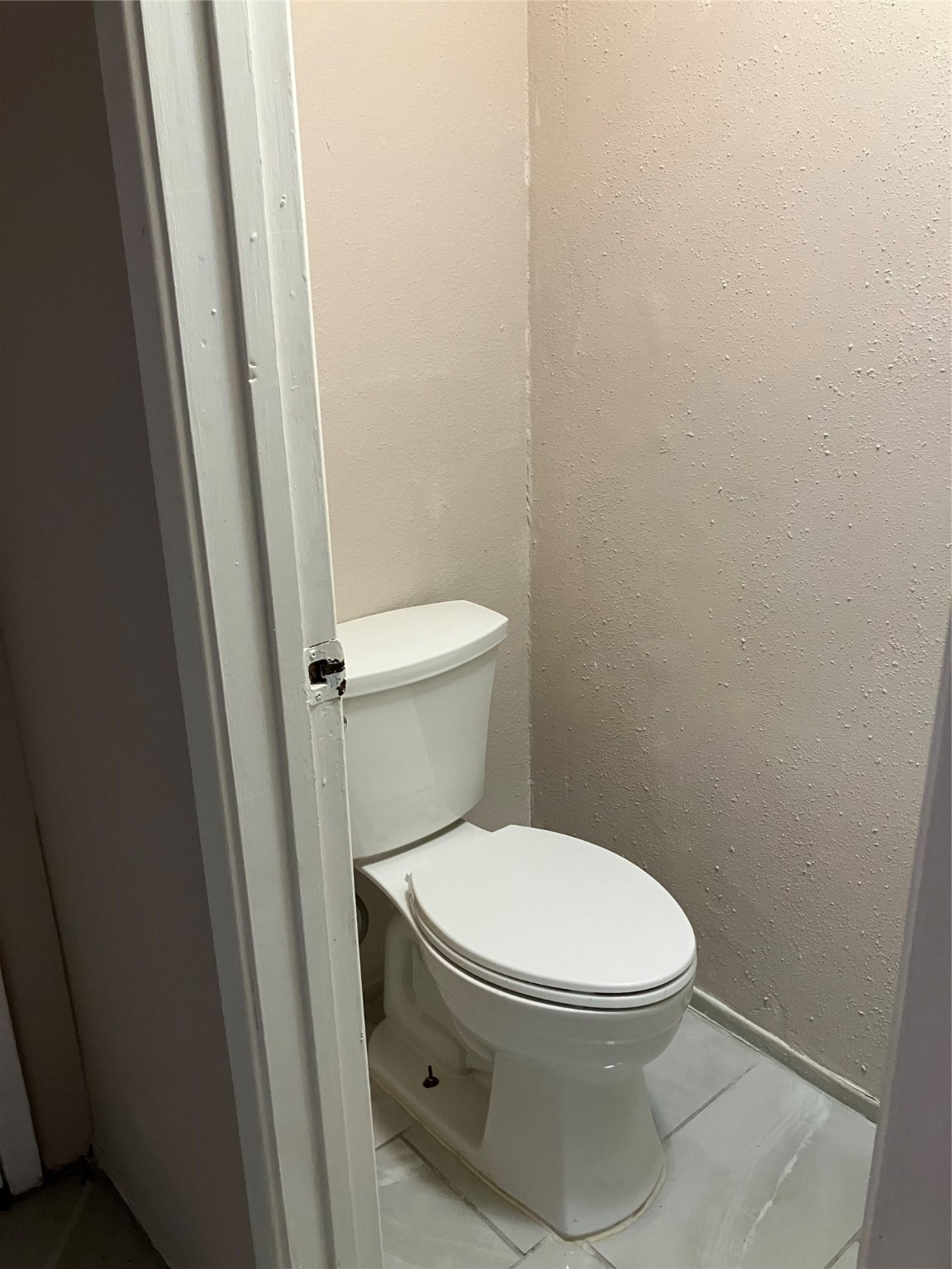 6001 Reims Road, Unit 1406 Houston, TX 77036 - Photo 3 of 13 a white toilet sitting next to a sink