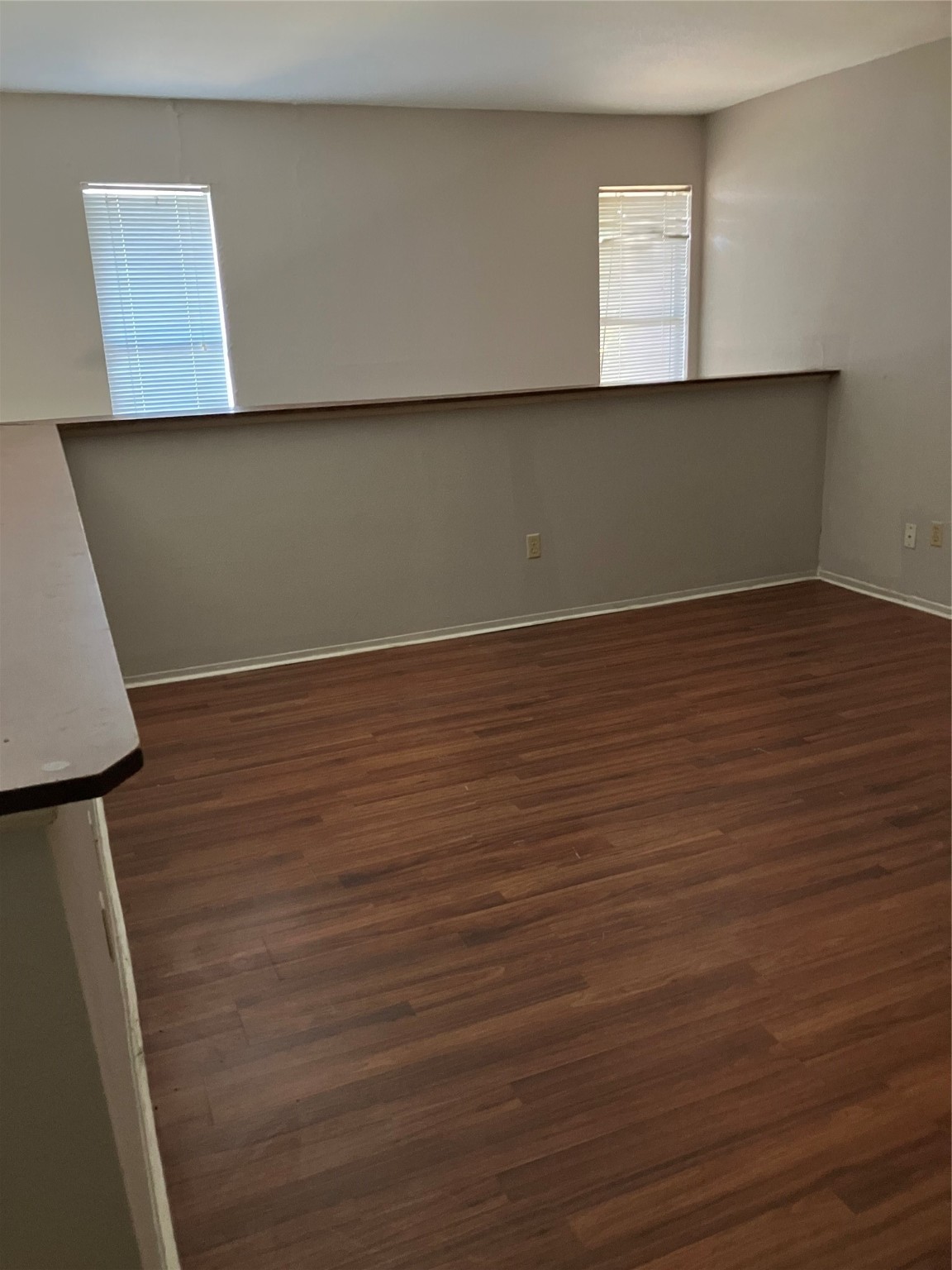 6001 Reims Road, Unit 1406 Houston, TX 77036 - Photo 7 of 13 a view of an empty room with wooden floor and a window