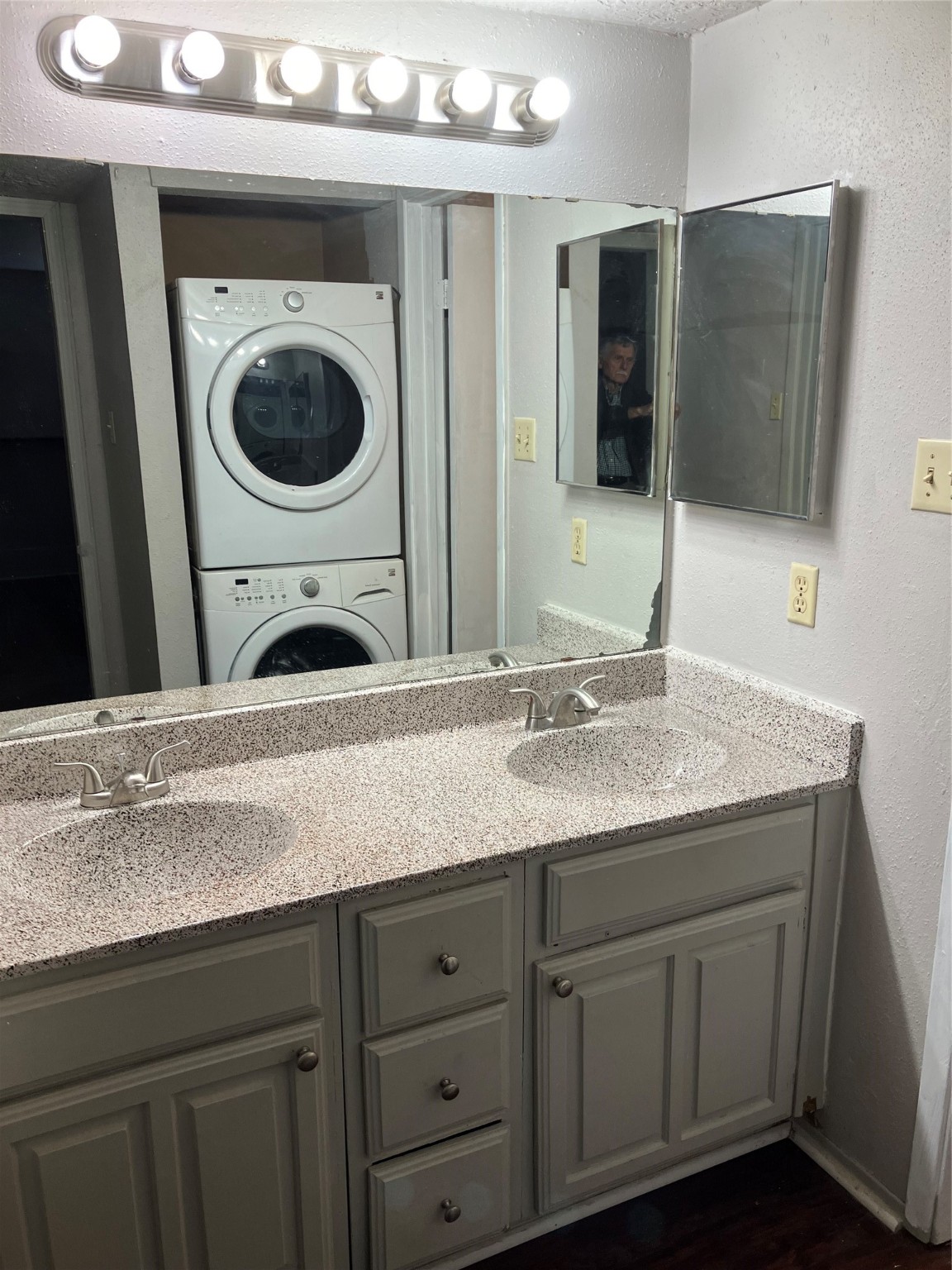 6001 Reims Road, Unit 1406 Houston, TX 77036 - Photo 9 of 13 a bathroom with a sink a large mirror and vanity