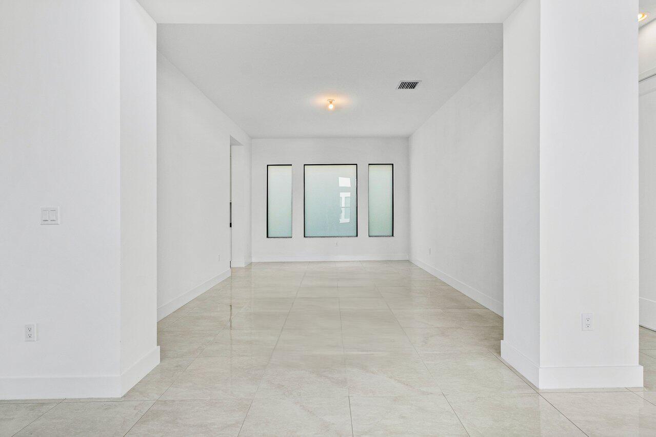 17056 Teton River Road Boca Raton, FL 33496 - Photo 15 of 76 a view of an empty room with a window
