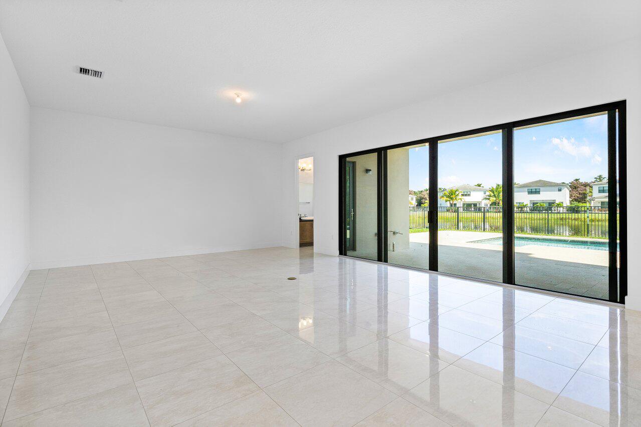 17056 Teton River Road Boca Raton, FL 33496 - Photo 17 of 76 a view of an empty room with a large window