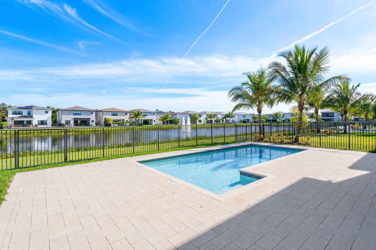 17056 Teton River Road Boca Raton, FL 33496 - Photo 3 of 76 a view of swimming pool with outdoor seating and yard in back