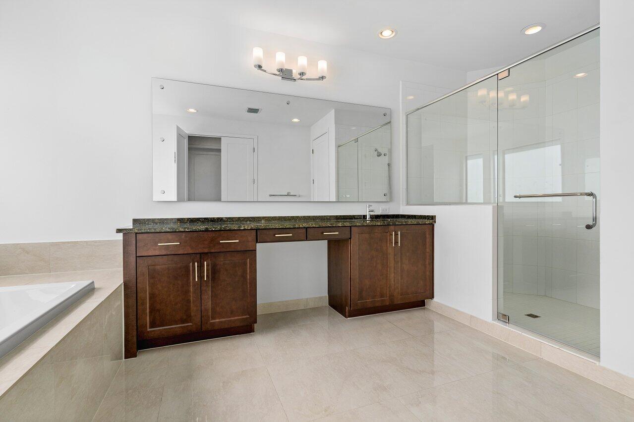 17056 Teton River Road Boca Raton, FL 33496 - Photo 32 of 76 a kitchen with stainless steel appliances granite countertop a stove a sink and a refrigerator