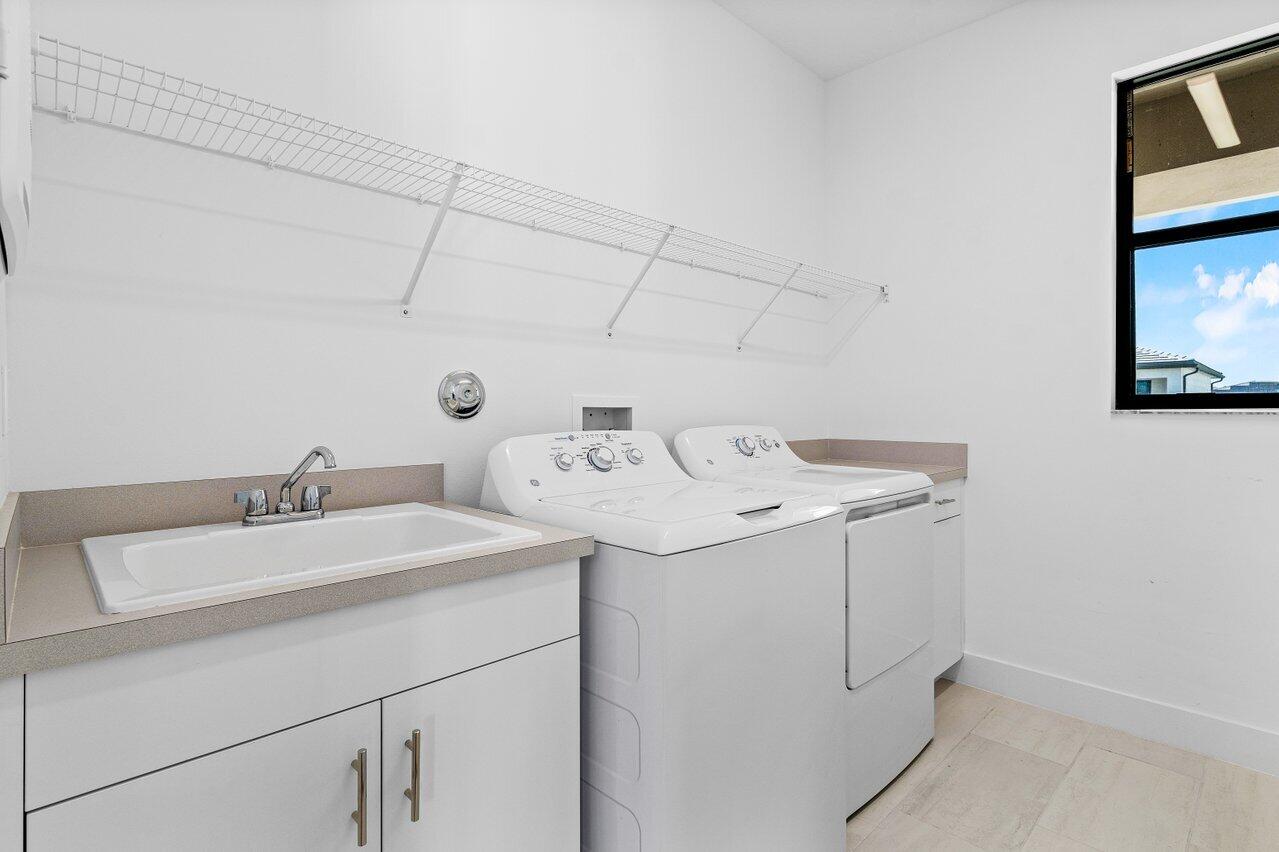 17056 Teton River Road Boca Raton, FL 33496 - Photo 38 of 76 a utility room with dryer and washer