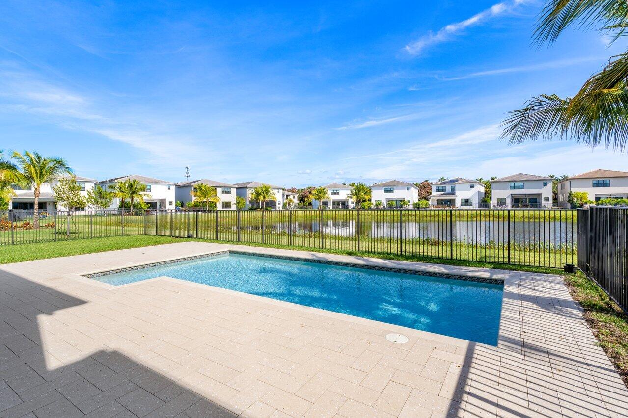 17056 Teton River Road Boca Raton, FL 33496 - Photo 42 of 76 a view of swimming pool with outdoor seating and yard