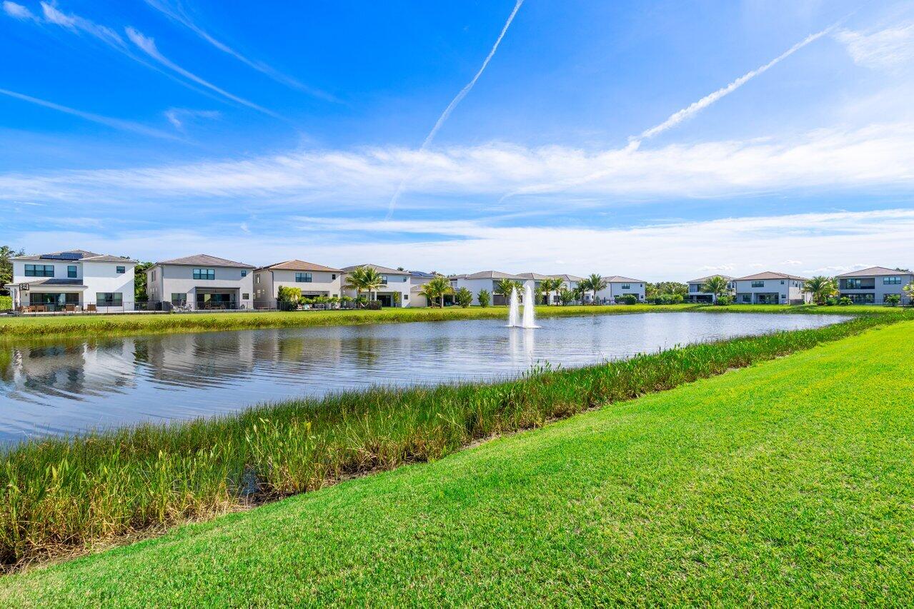 17056 Teton River Road Boca Raton, FL 33496 - Photo 46 of 76 a view of a lake with houses in the back