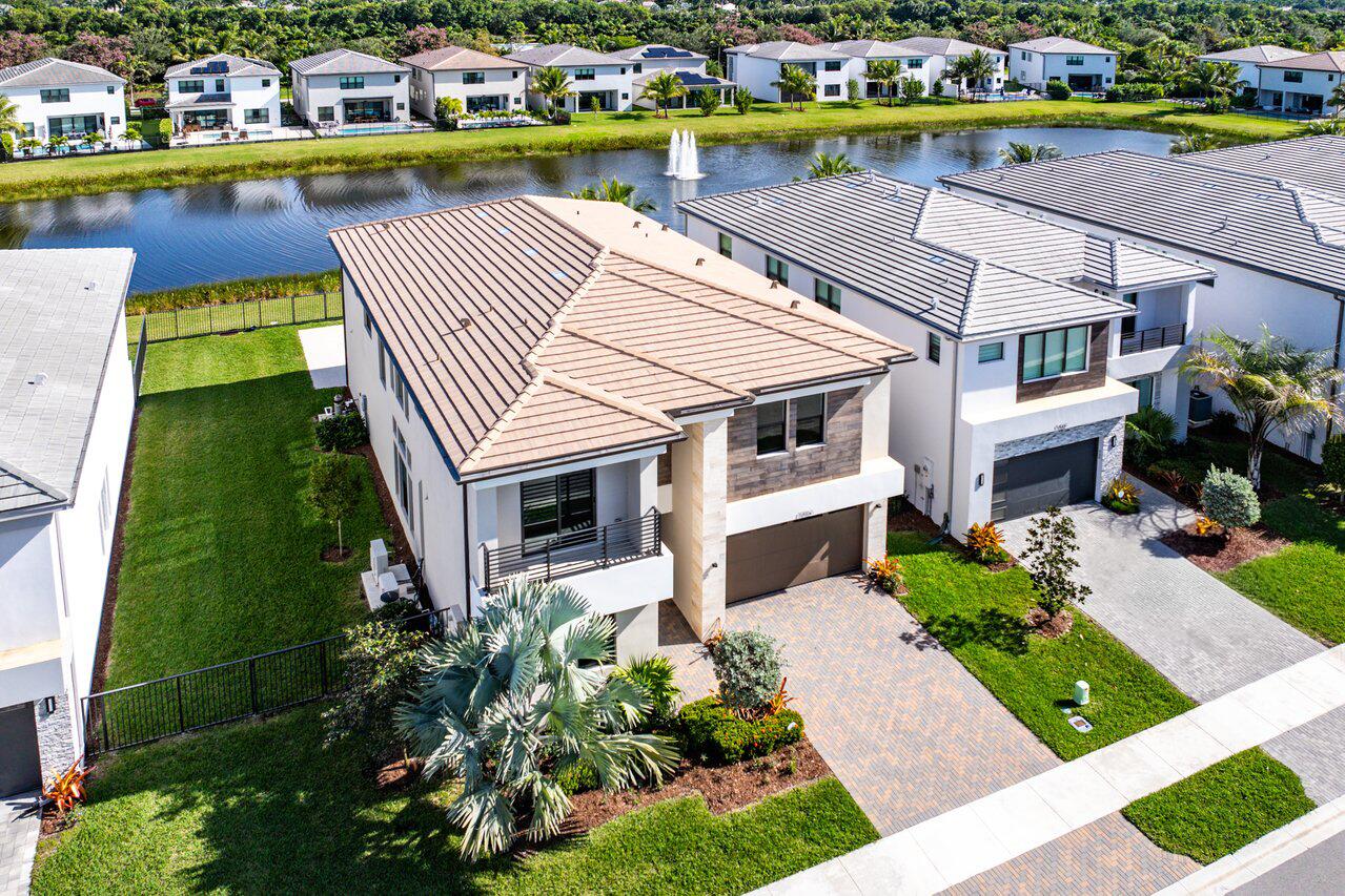 17056 Teton River Road Boca Raton, FL 33496 - Photo 49 of 76 a aerial view of a house with a yard and a garden