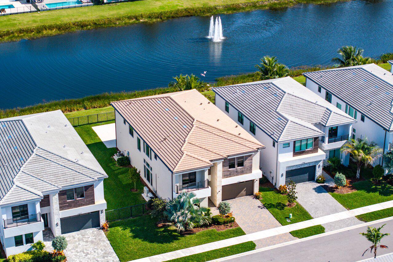 17056 Teton River Road Boca Raton, FL 33496 - Photo 52 of 76 a aerial view of a house with a yard table and chairs
