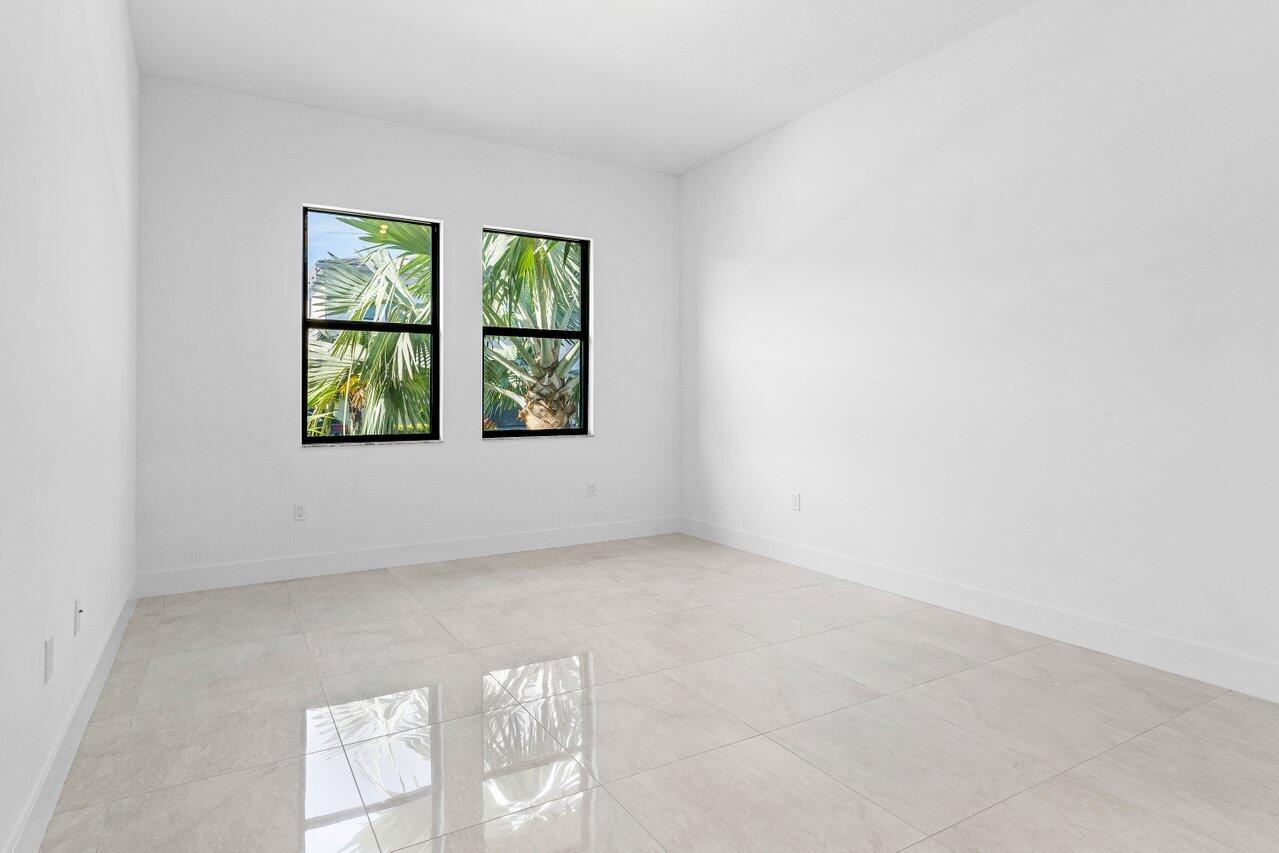 17056 Teton River Road Boca Raton, FL 33496 - Photo 9 of 76 an empty room with windows