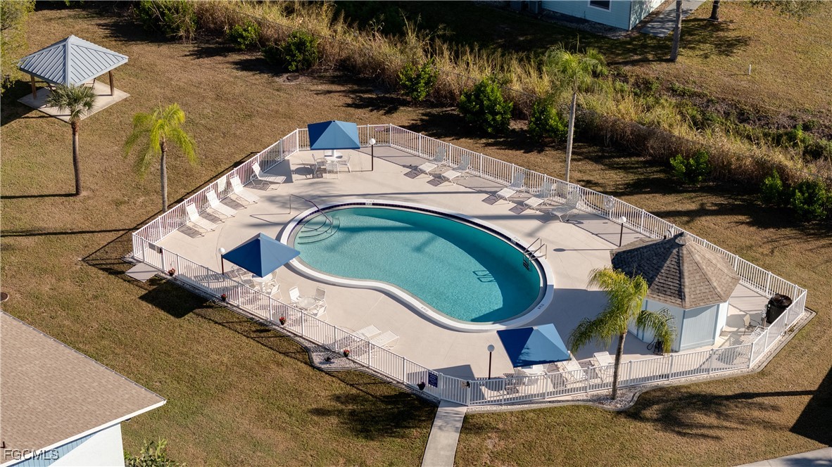 1100 Pondella Road, Unit 916 Cape Coral, FL 33909 - Photo 2 of 26 an aerial view of a house with backyard