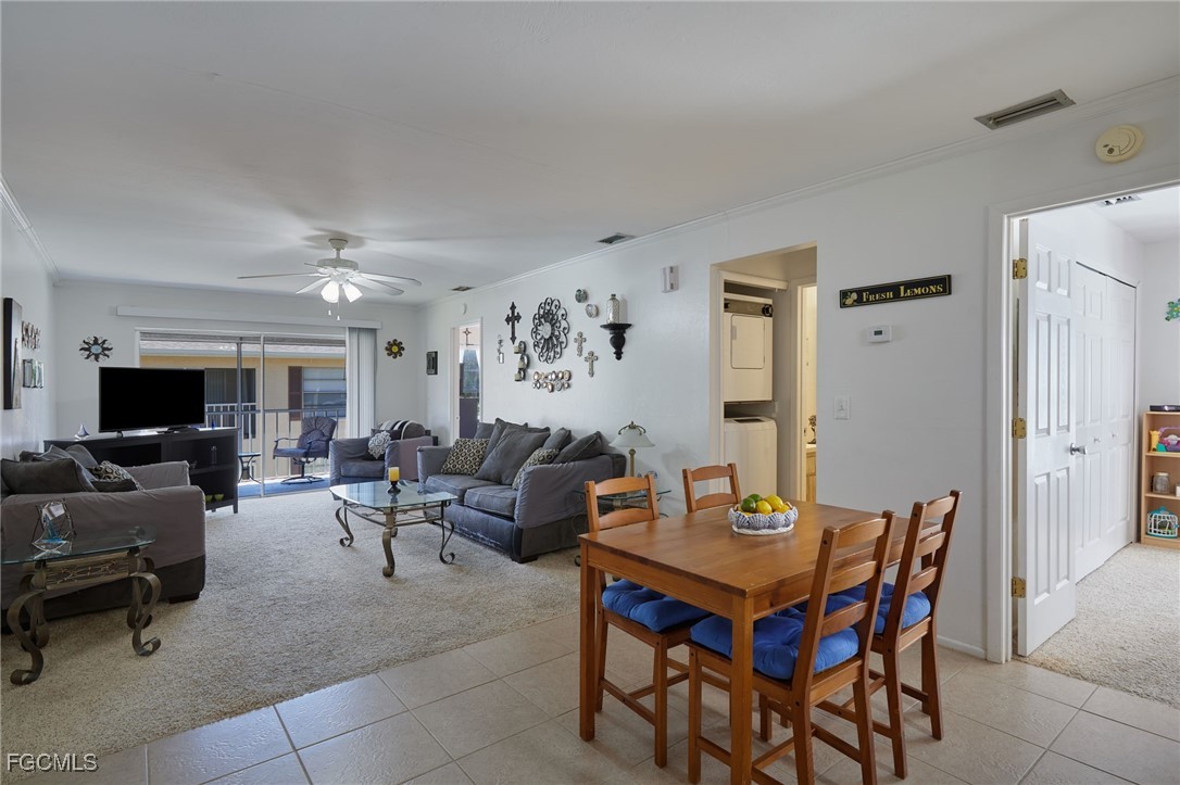 1100 Pondella Road, Unit 916 Cape Coral, FL 33909 - Photo 9 of 26 a living room with furniture and a flat screen tv