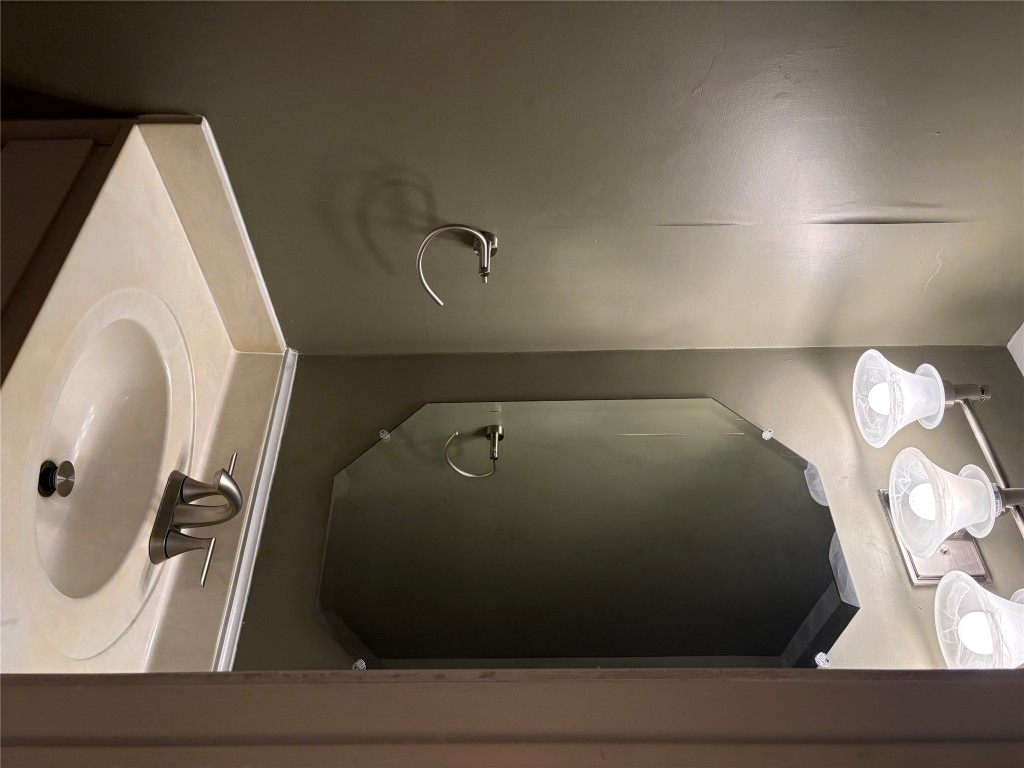 9226 Jollyville Road, Unit 144 Austin, TX 78759 - Photo 11 of 40 Downstairs Half Bath featuring vanity