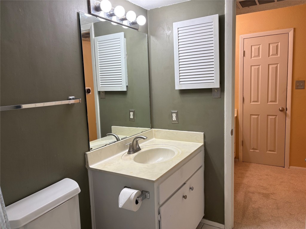 9226 Jollyville Road, Unit 144 Austin, TX 78759 - Photo 19 of 40 Bathroom with vanity and light carpet